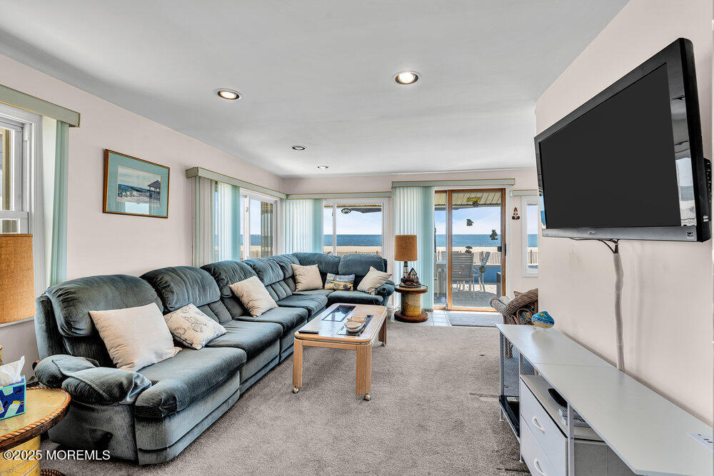 115 Beach Front Manasquan, NJ 08736 - Photo 19 of 32 a living room with furniture and a flat screen tv