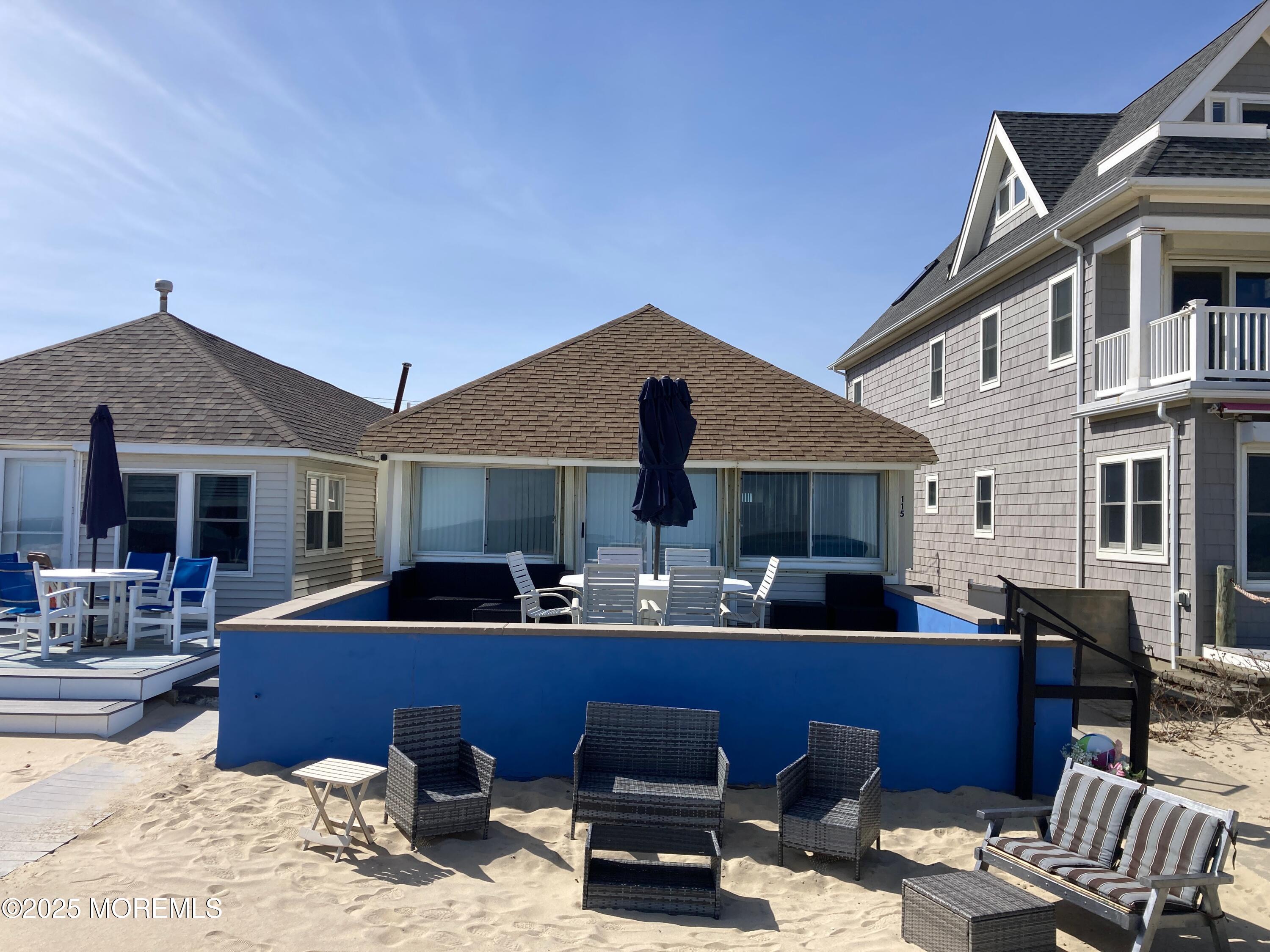 115 Beach Front Manasquan, NJ 08736 - Photo 2 of 32 a view of a house with patio
