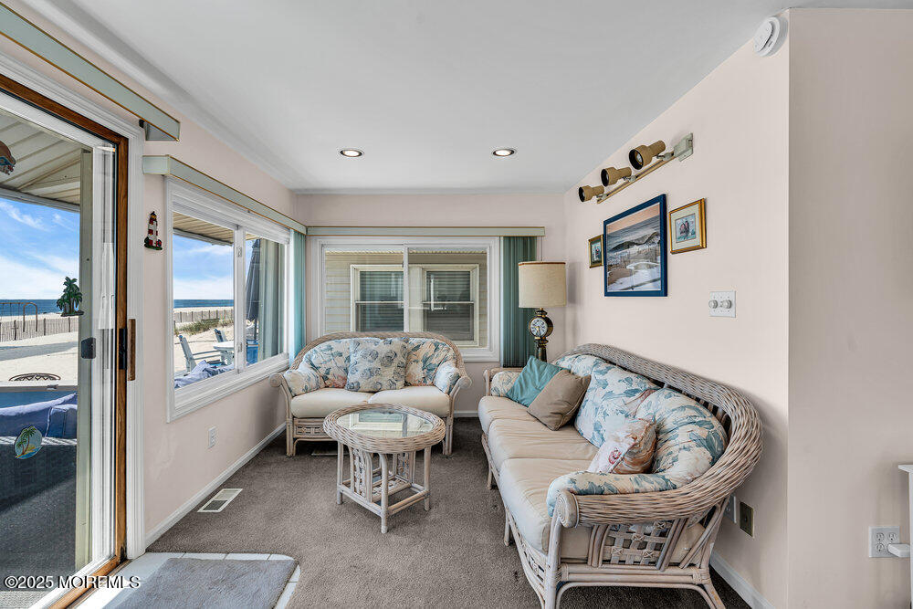 115 Beach Front Manasquan, NJ 08736 - Photo 22 of 32 a living room with furniture and a large window