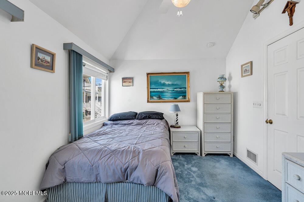 115 Beach Front Manasquan, NJ 08736 - Photo 27 of 32 a bedroom with a bed and a window
