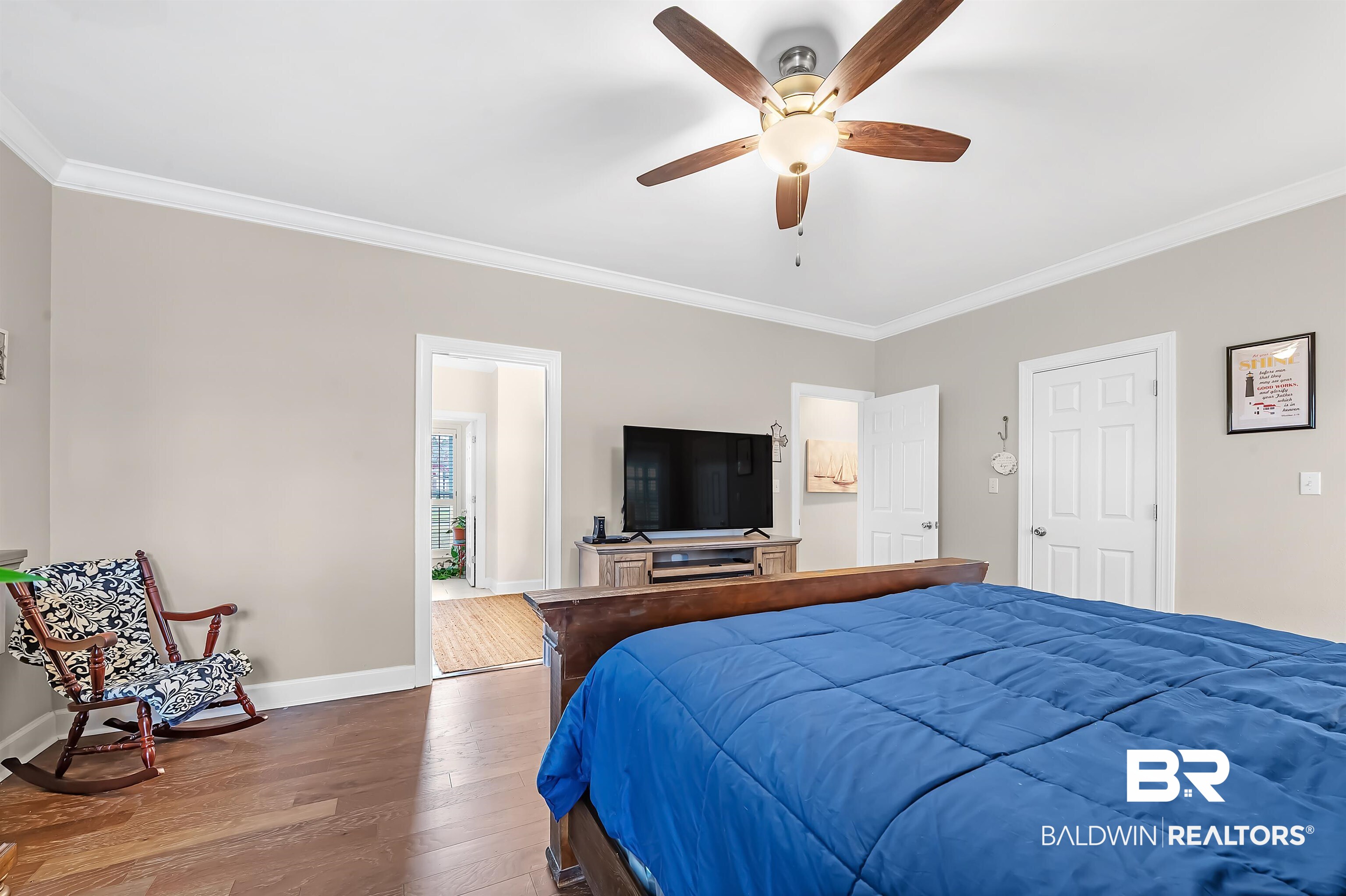 8915 Bay Point Drive Elberta, AL 36530 - Photo 52 of 74 Bedroom with ceiling fan, crown molding, baseboards, and wood finished floors
