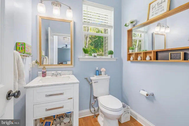 a view of staircase with railing and a window