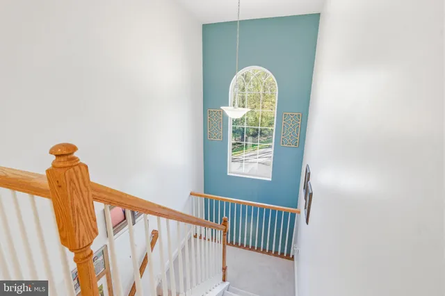 a bedroom with a bed and table chair