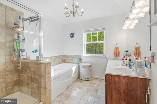 a bedroom with bed and a window