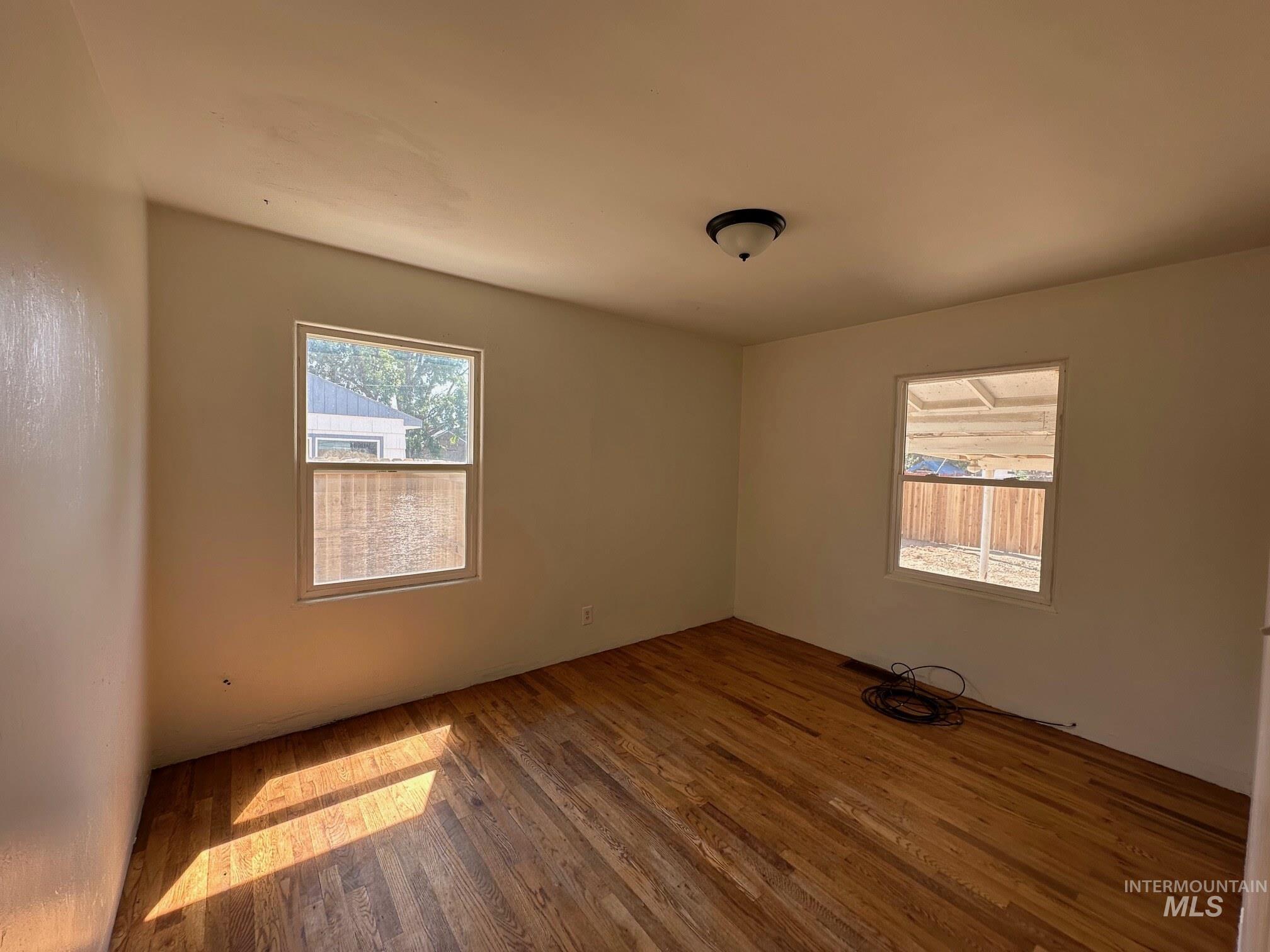 264 Southwest 10th Avenue Ontario, OR 97914 - Photo 13 of 29 Unfurnished room featuring wood finished floors