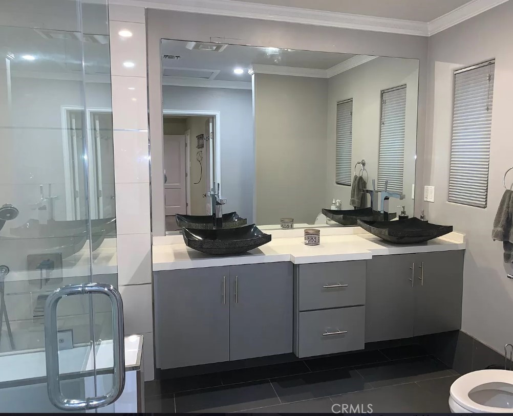 1338 North Jackson Street Glendale, CA 91207 - Photo 20 of 24 a bathroom with a double vanity sink and mirror