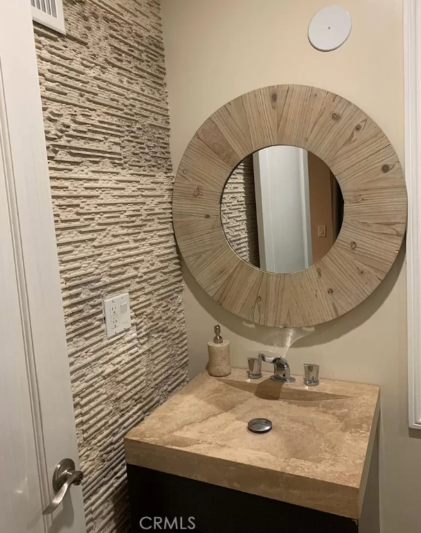 1338 North Jackson Street Glendale, CA 91207 - Photo 2 of 24 a bathroom with a sink and mirror