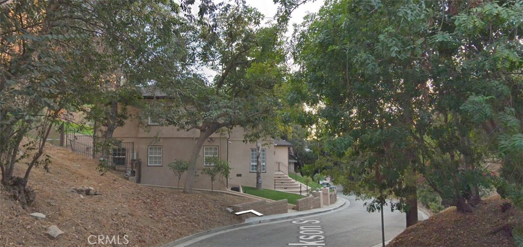 1338 North Jackson Street Glendale, CA 91207 - Photo 3 of 24 a view of a yard with plants and large trees