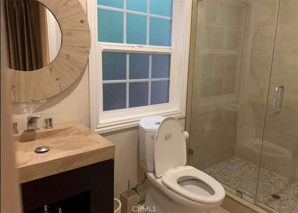1338 North Jackson Street Glendale, CA 91207 - Photo 5 of 24 a bathroom with a sink a toilet and shower