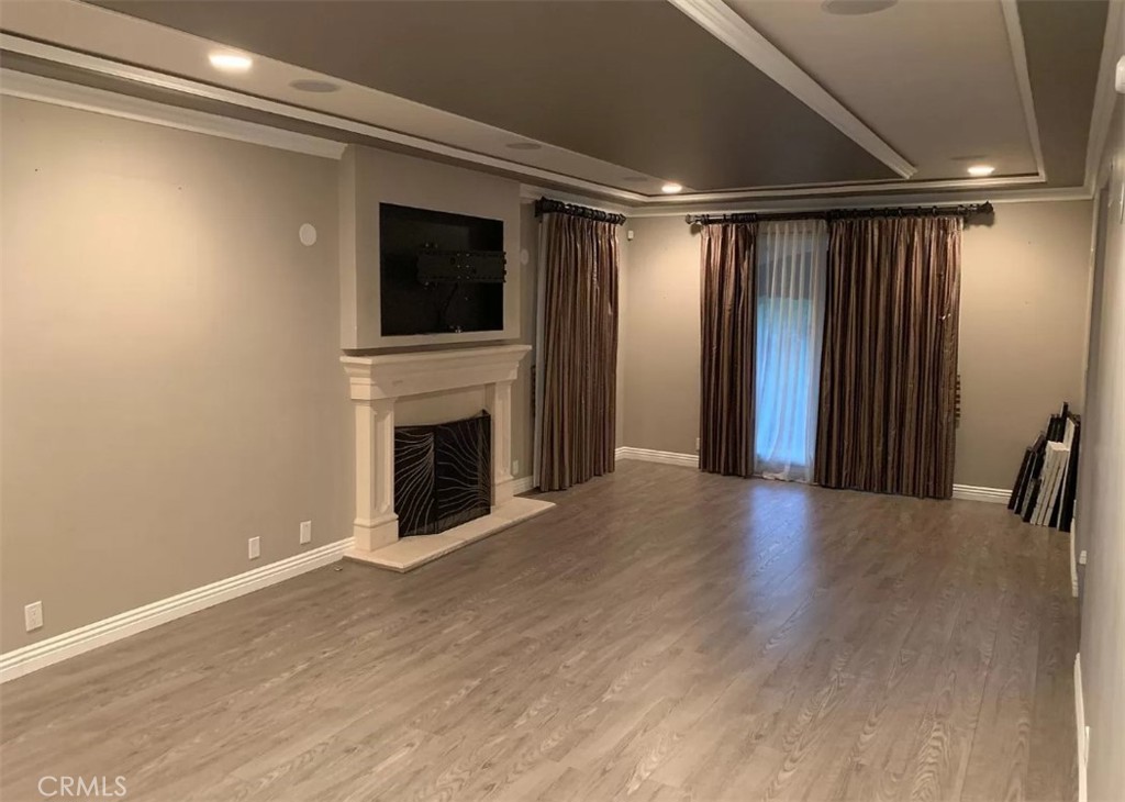 1338 North Jackson Street Glendale, CA 91207 - Photo 7 of 24 a view of an empty room with wooden floor and a window