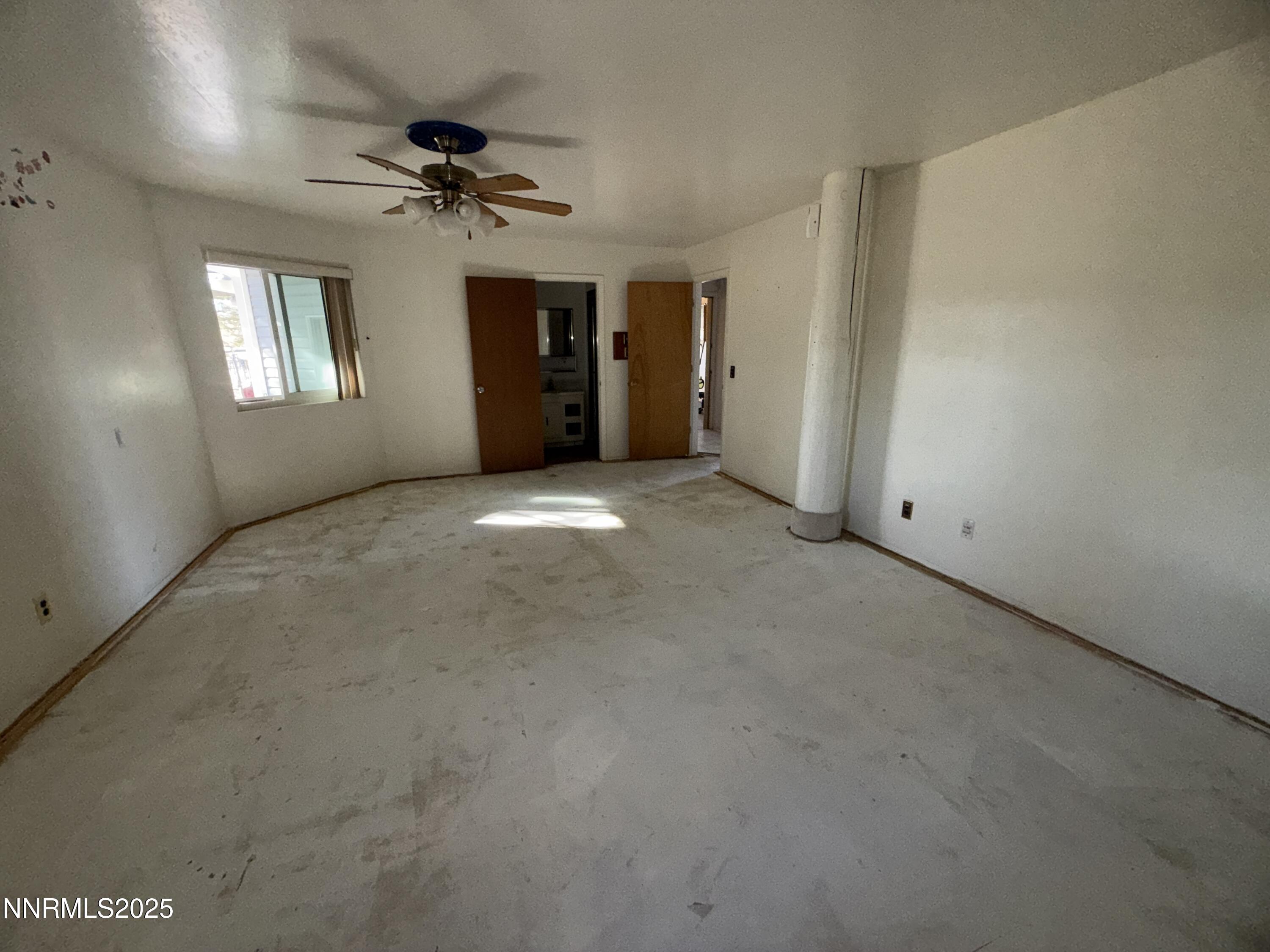 10160 Blackhawk Drive Reno, NV 89508 - Photo 16 of 43 a view of a big room with windows and chandelier fan
