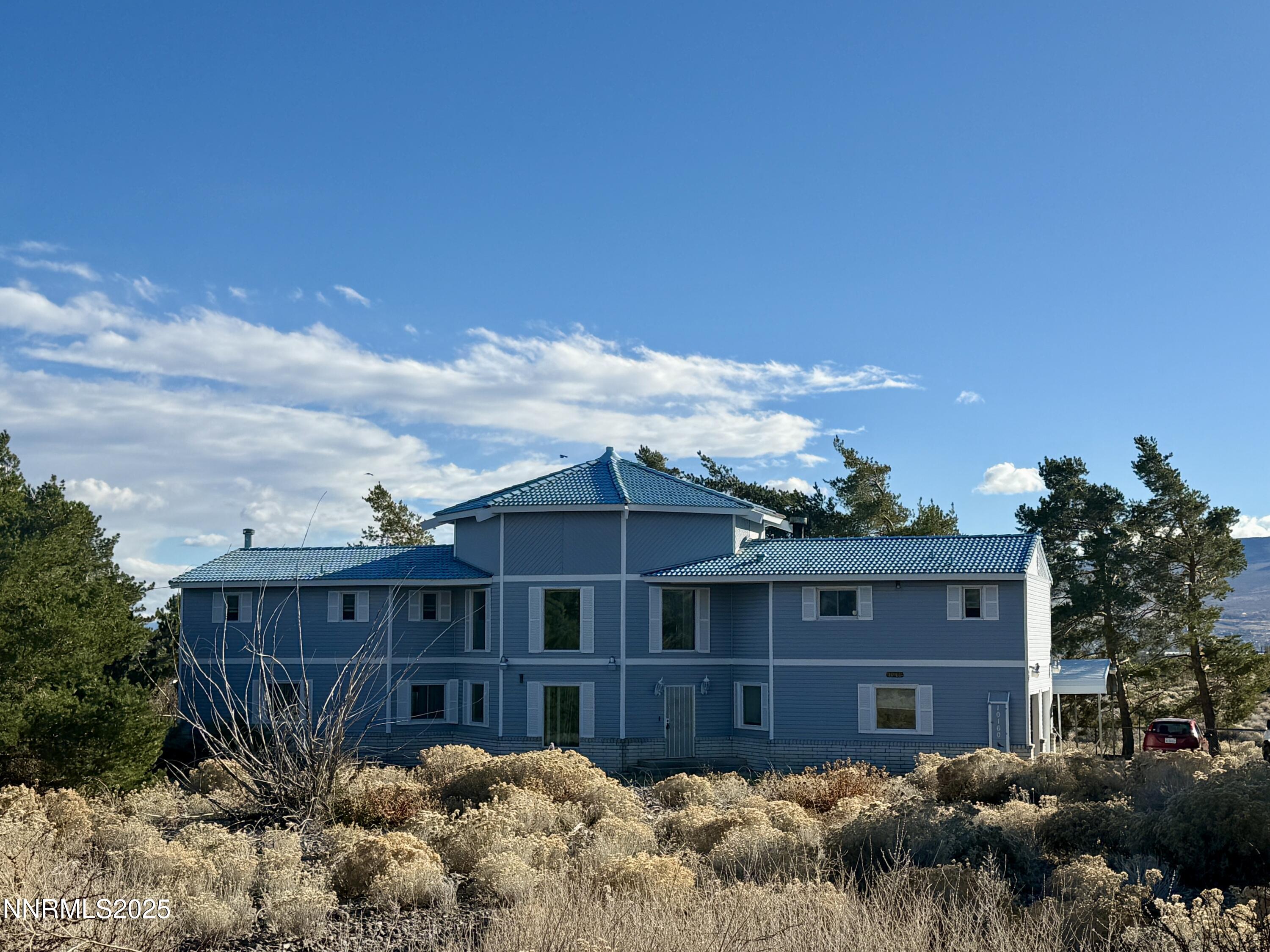 10160 Blackhawk Drive Reno, NV 89508 - Photo 2 of 43 a view of a brick house next to a yard