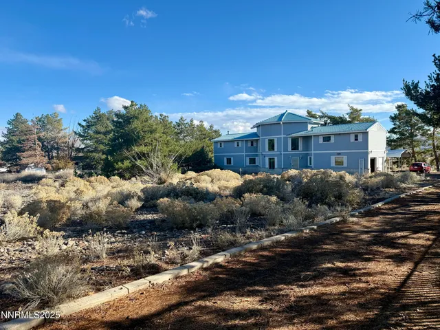 a view of a large building with a yard