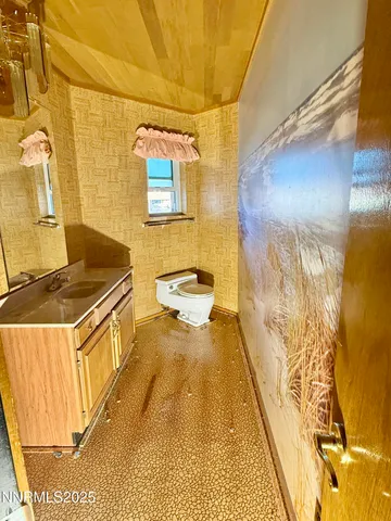 a kitchen with stainless steel appliances granite countertop a refrigerator a stove and a sink