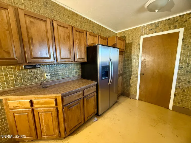 a kitchen with granite countertop a stove and a sink