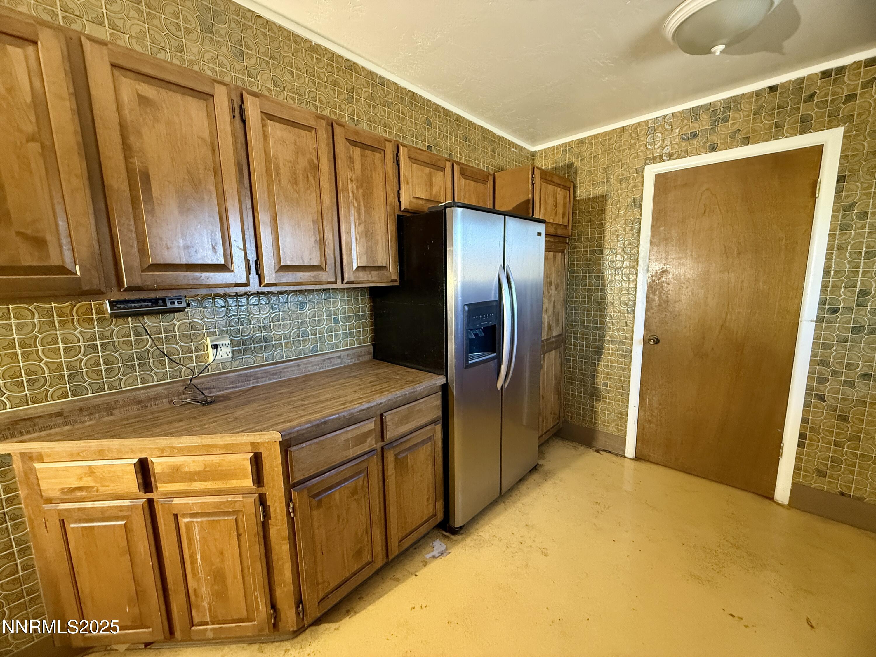 10160 Blackhawk Drive Reno, NV 89508 - Photo 36 of 43 a kitchen with stainless steel appliances granite countertop a refrigerator and a sink