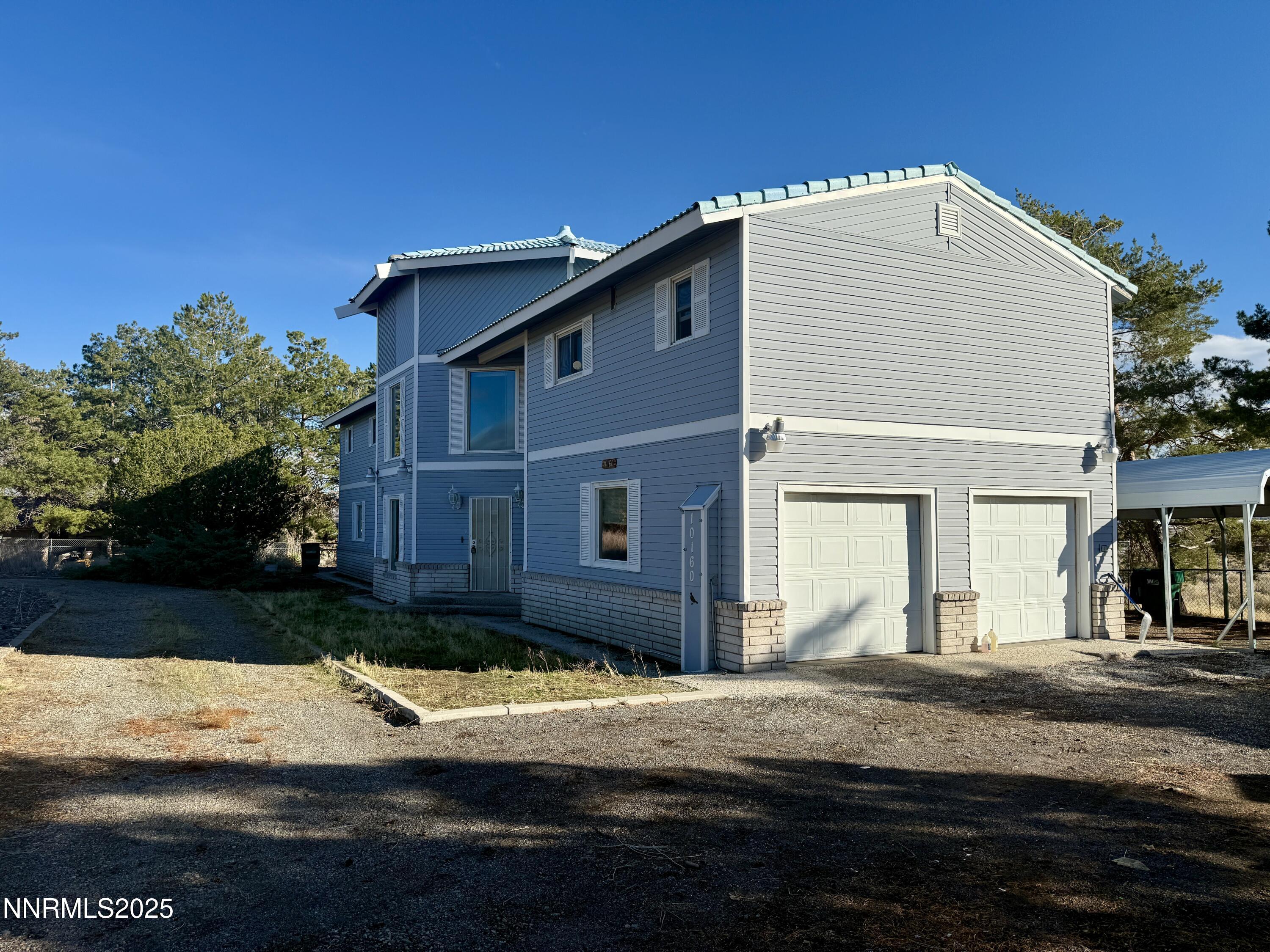 10160 Blackhawk Drive Reno, NV 89508 - Photo 4 of 43 a front view of a house with a yard