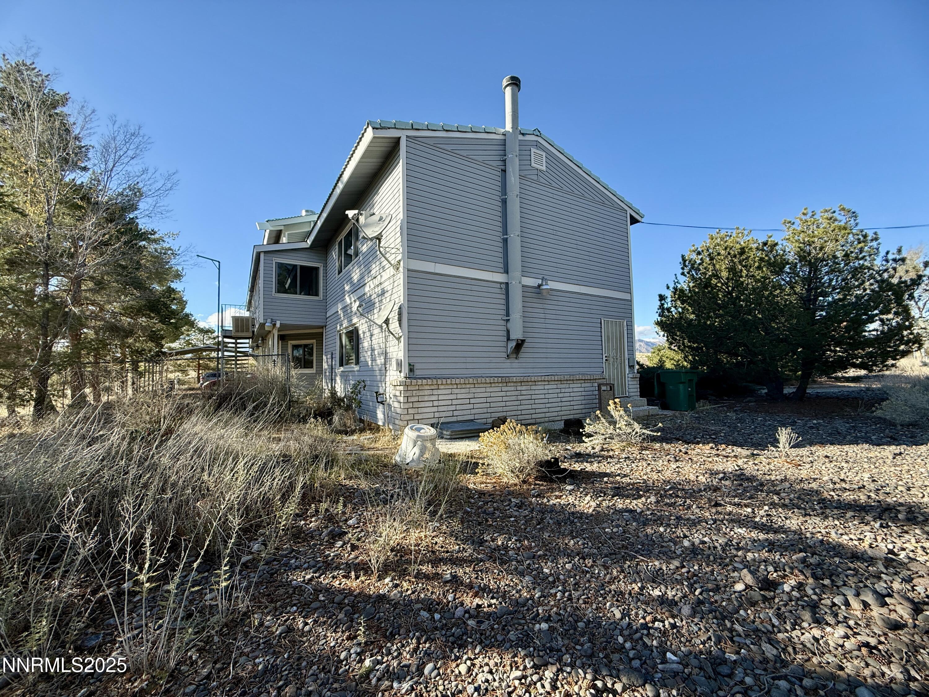 10160 Blackhawk Drive Reno, NV 89508 - Photo 8 of 43 a backyard of a house with lots of green space