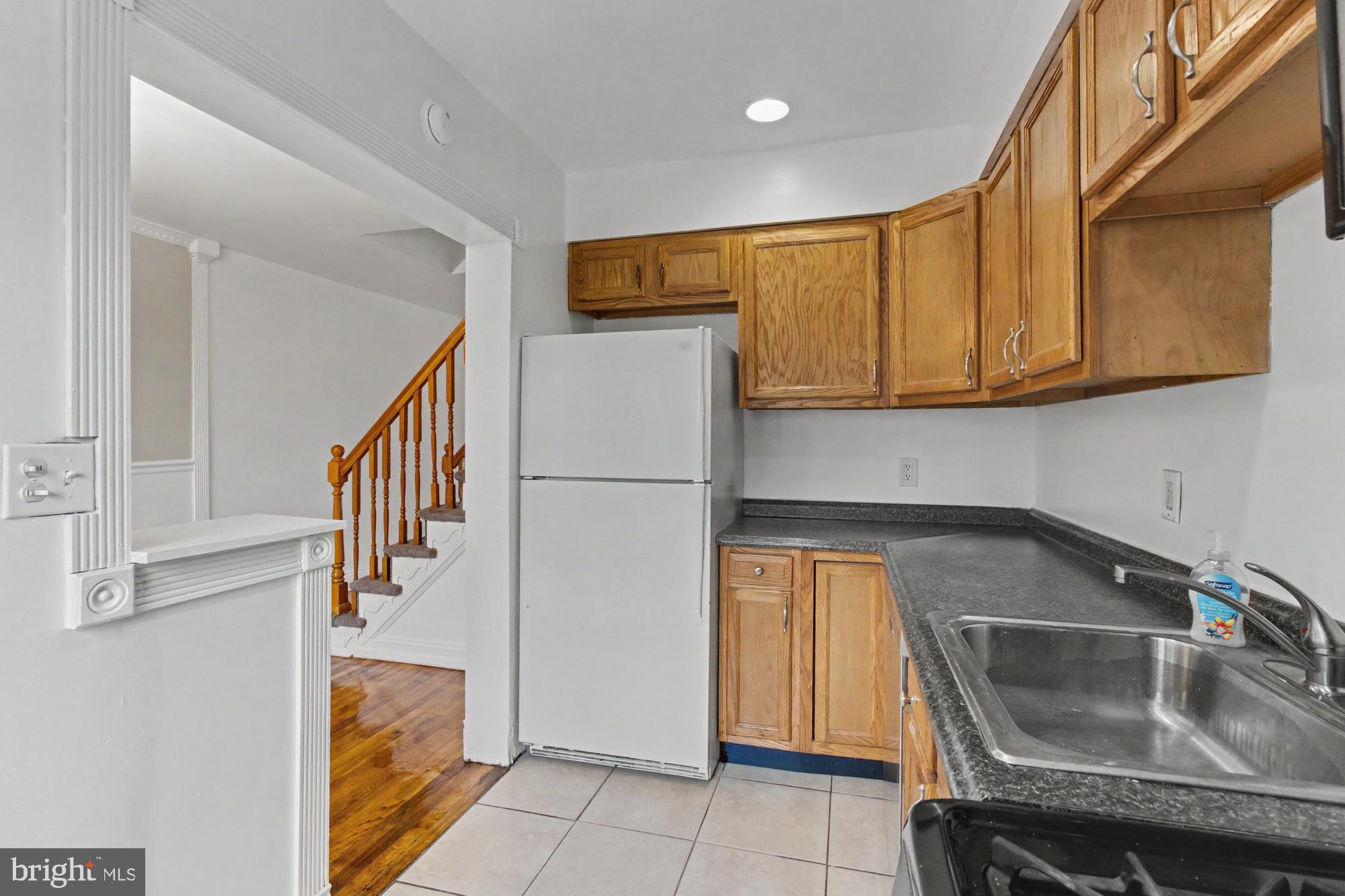 8218 Kavanagh Road Dundalk, MD 21222 - Photo 17 of 39 Cozy kitchen with warm wood accents.
