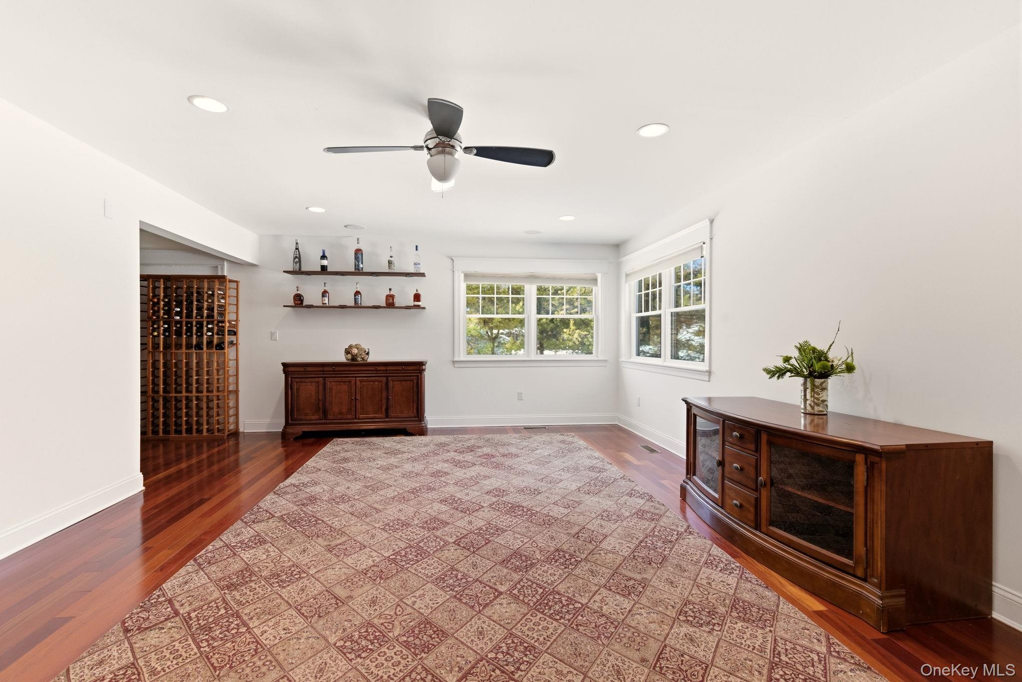 9 Mariners Court Centerport, NY 11721 - Photo 13 of 40 a living room with furniture and a window