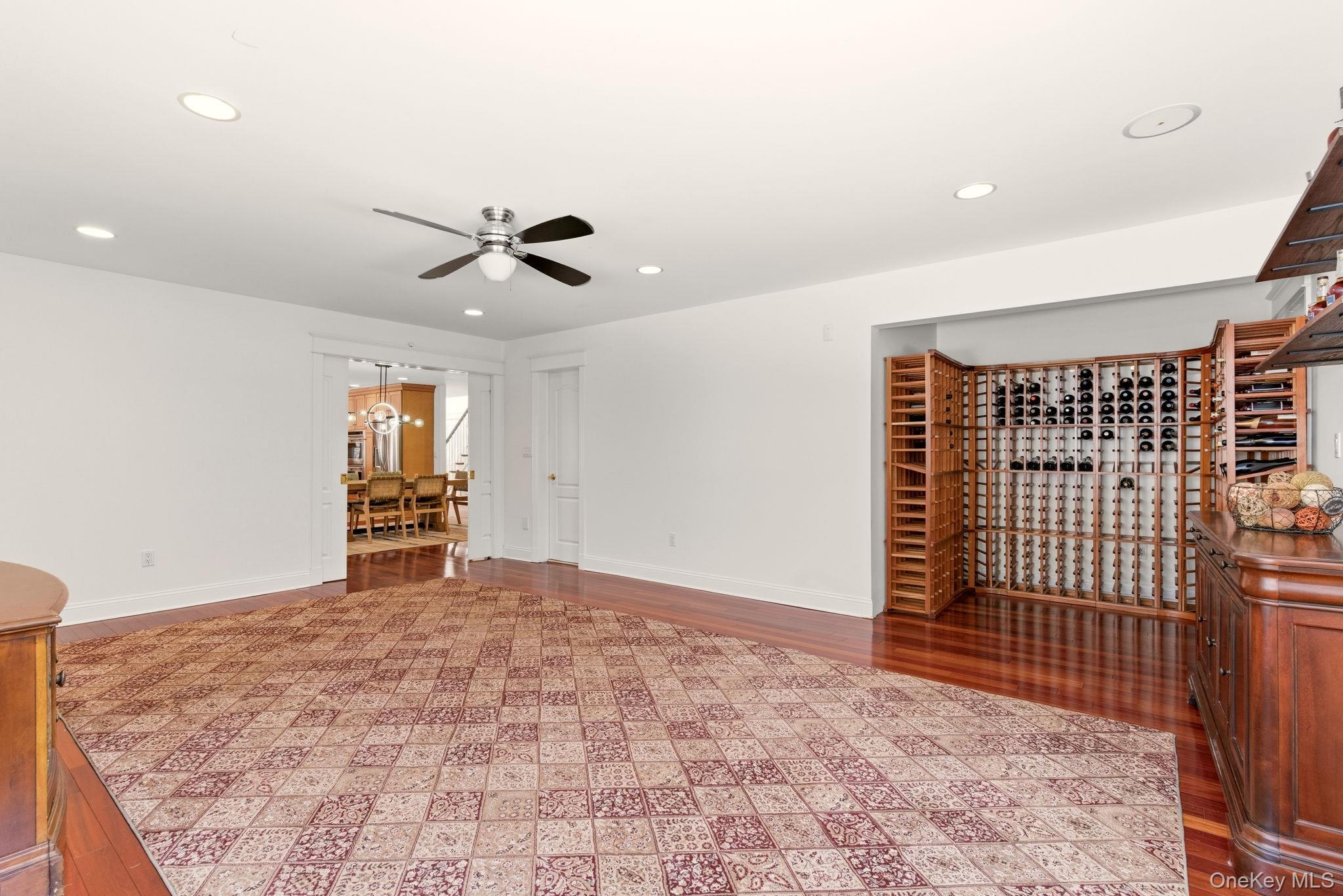 9 Mariners Court Centerport, NY 11721 - Photo 14 of 40 a view of an empty room with a ceiling fan