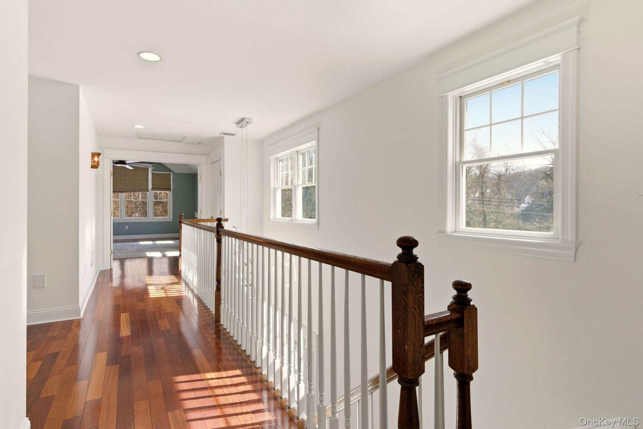 9 Mariners Court Centerport, NY 11721 - Photo 19 of 40 a view of a hallway with windows and stairs