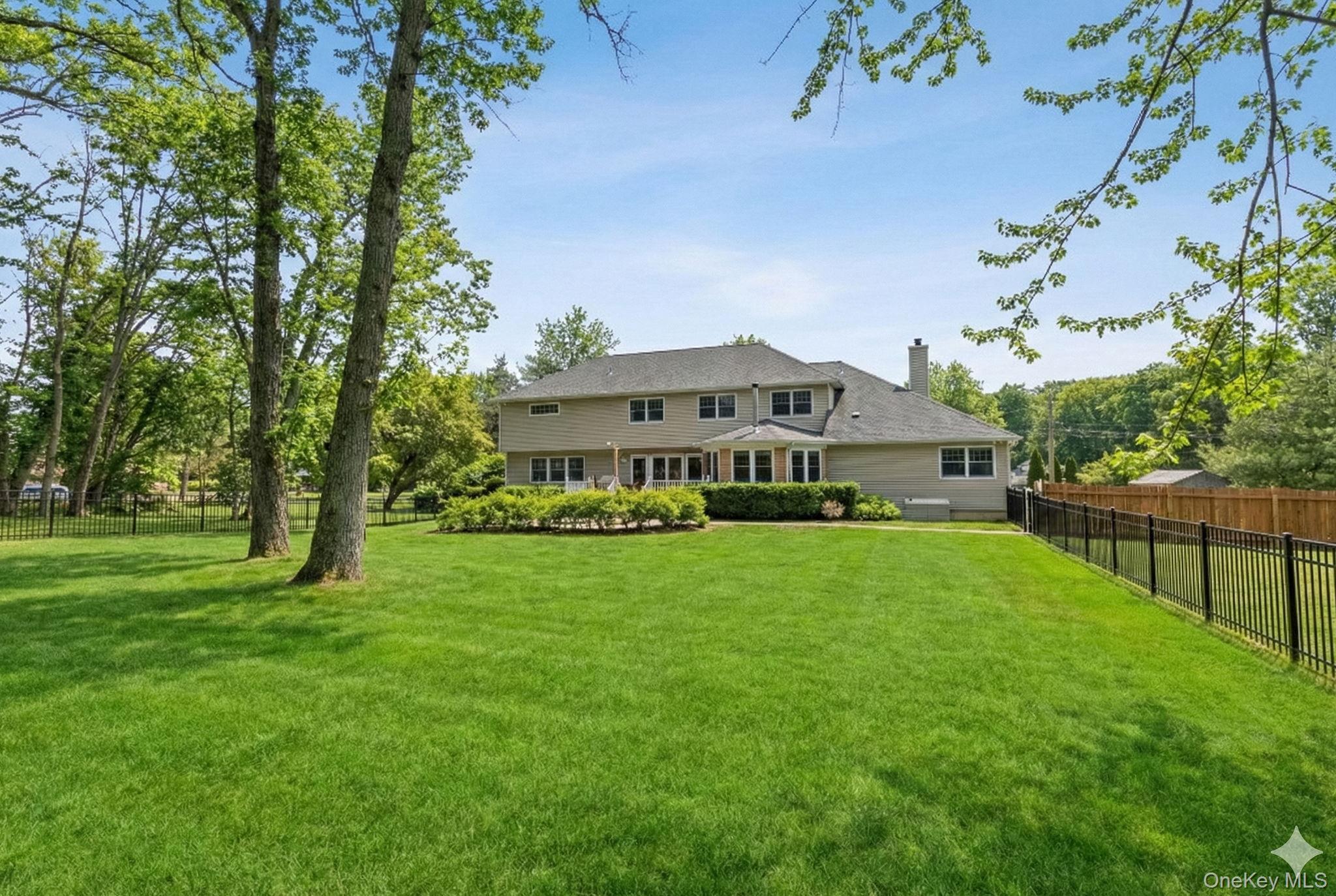 9 Mariners Court Centerport, NY 11721 - Photo 2 of 40 a view of a house with a big yard