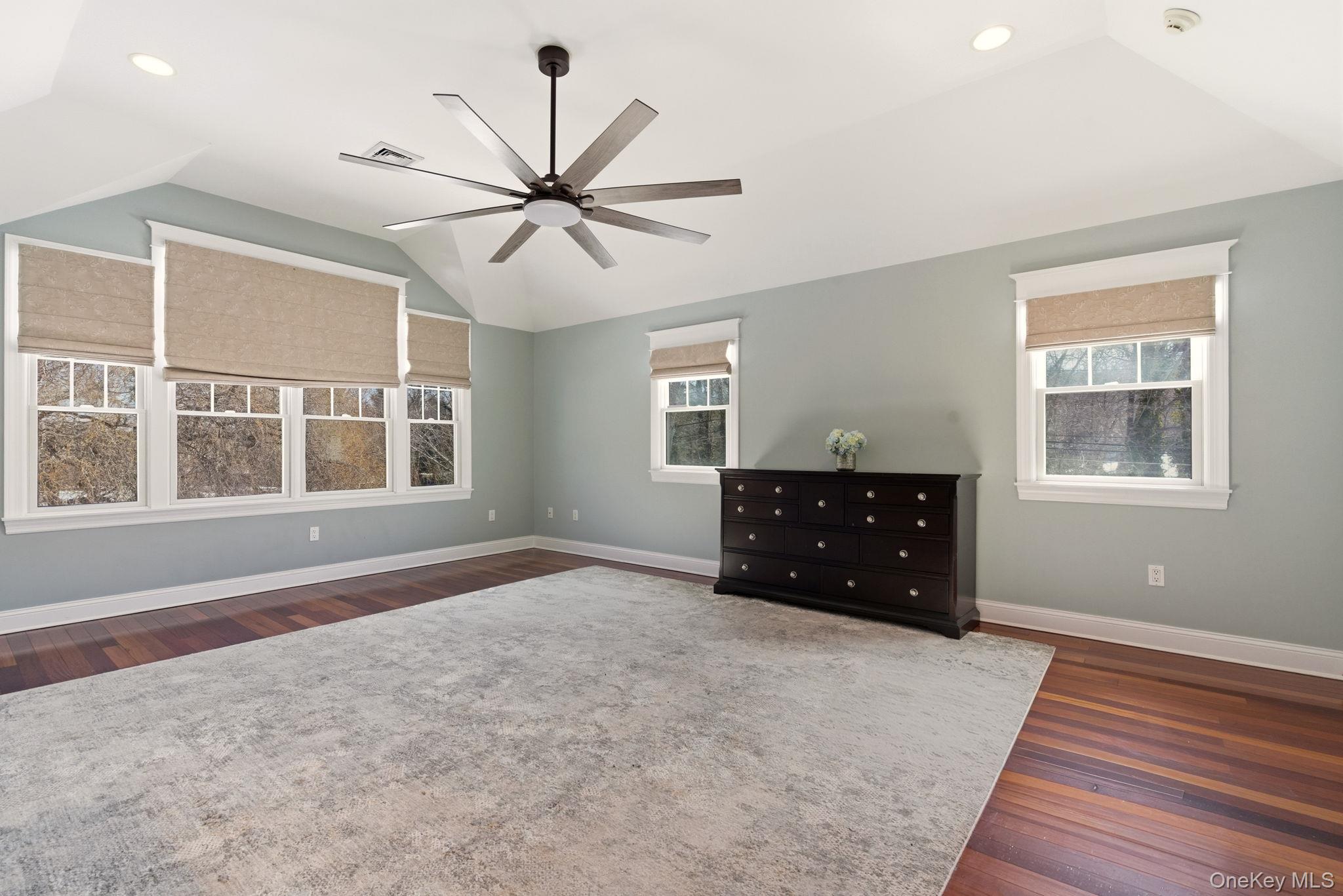9 Mariners Court Centerport, NY 11721 - Photo 22 of 40 a living room with a bed and a window
