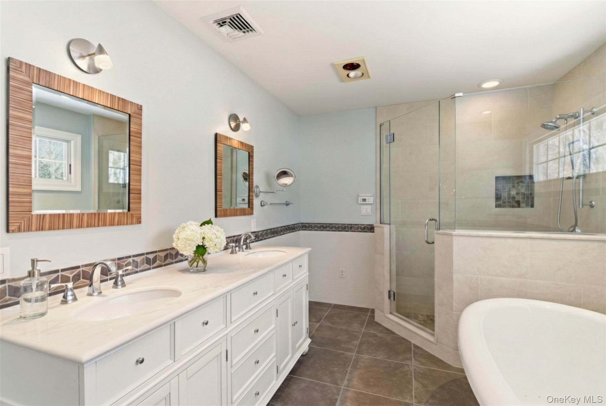 9 Mariners Court Centerport, NY 11721 - Photo 23 of 40 a bathroom with a sink a toilet and shower