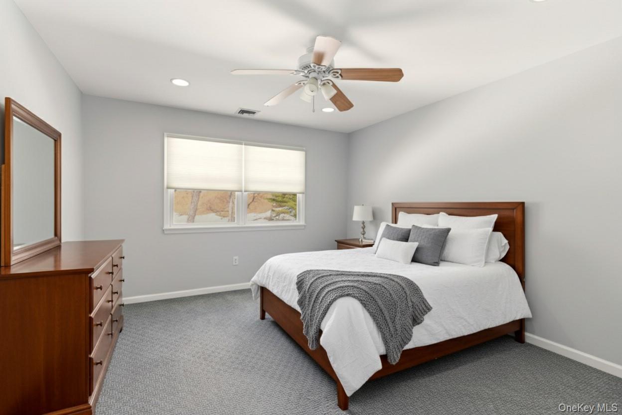 9 Mariners Court Centerport, NY 11721 - Photo 25 of 40 a bedroom with a bed and a window