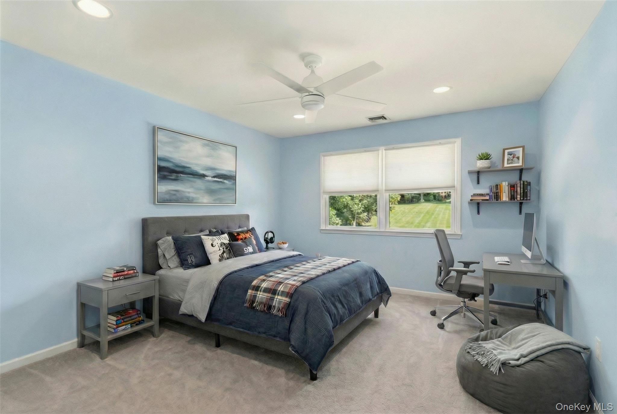 9 Mariners Court Centerport, NY 11721 - Photo 27 of 40 a bedroom with a bed a couch and a window