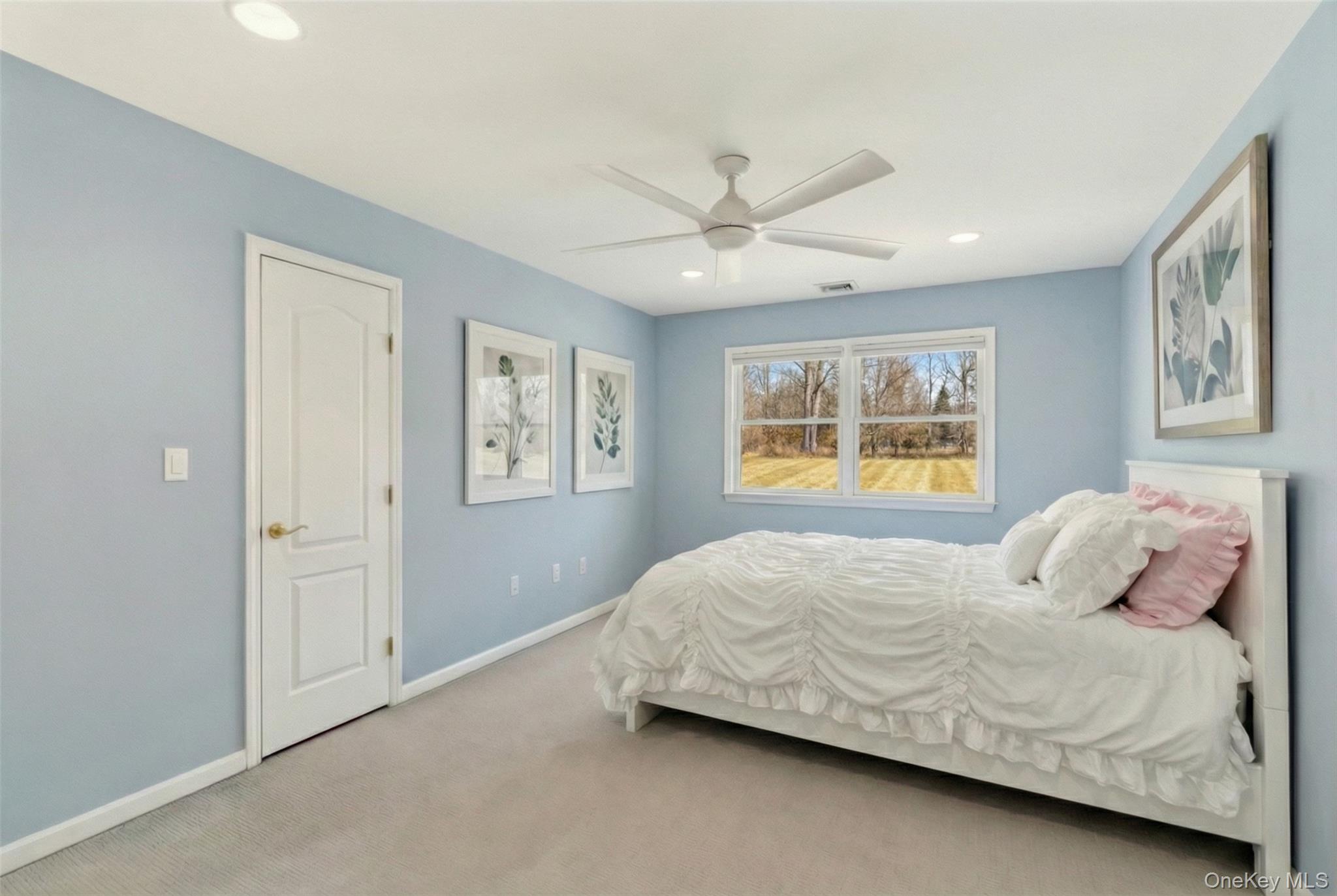 9 Mariners Court Centerport, NY 11721 - Photo 29 of 40 a bedroom with a bed and a window