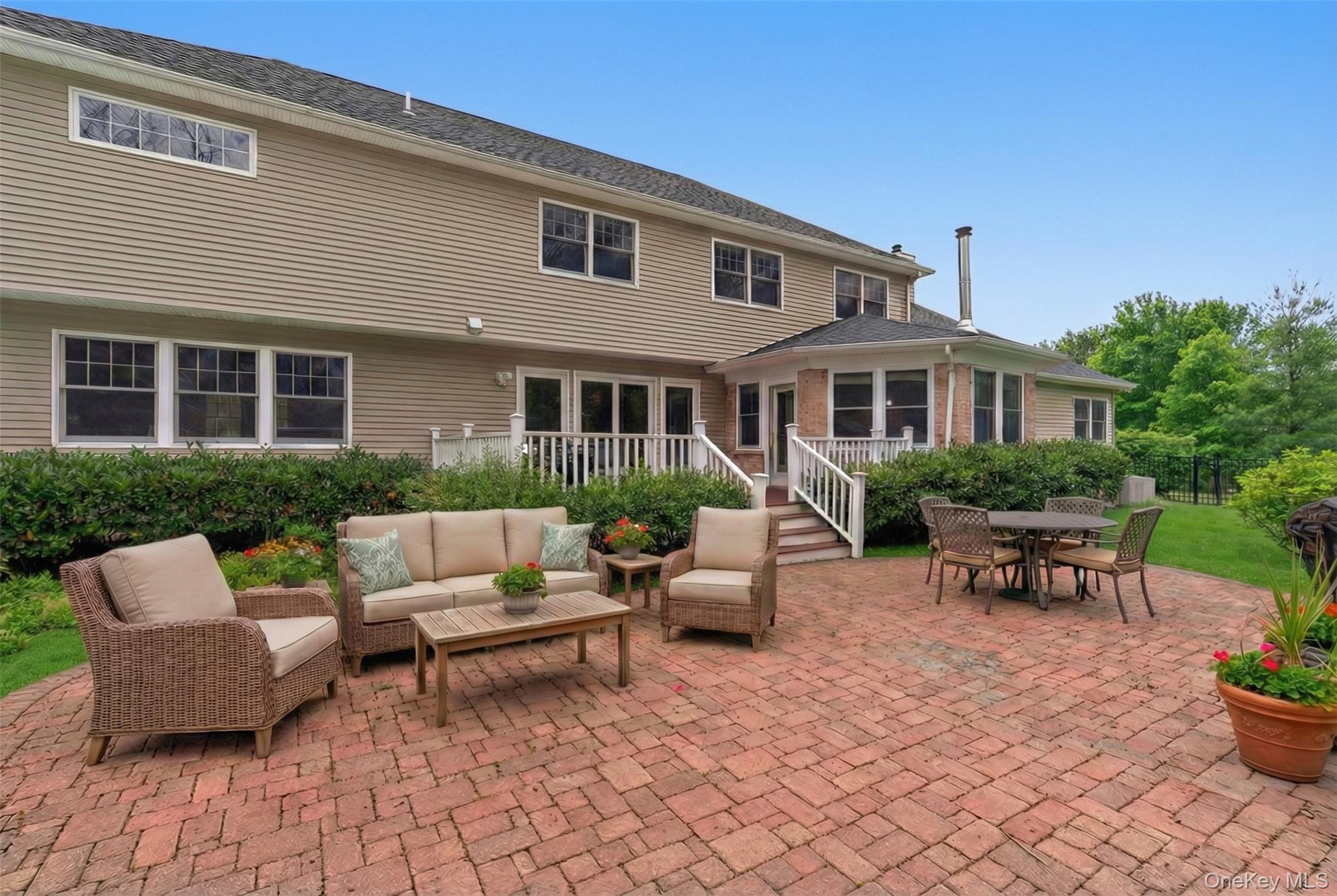 9 Mariners Court Centerport, NY 11721 - Photo 33 of 40 a view of a house with a backyard and sitting area