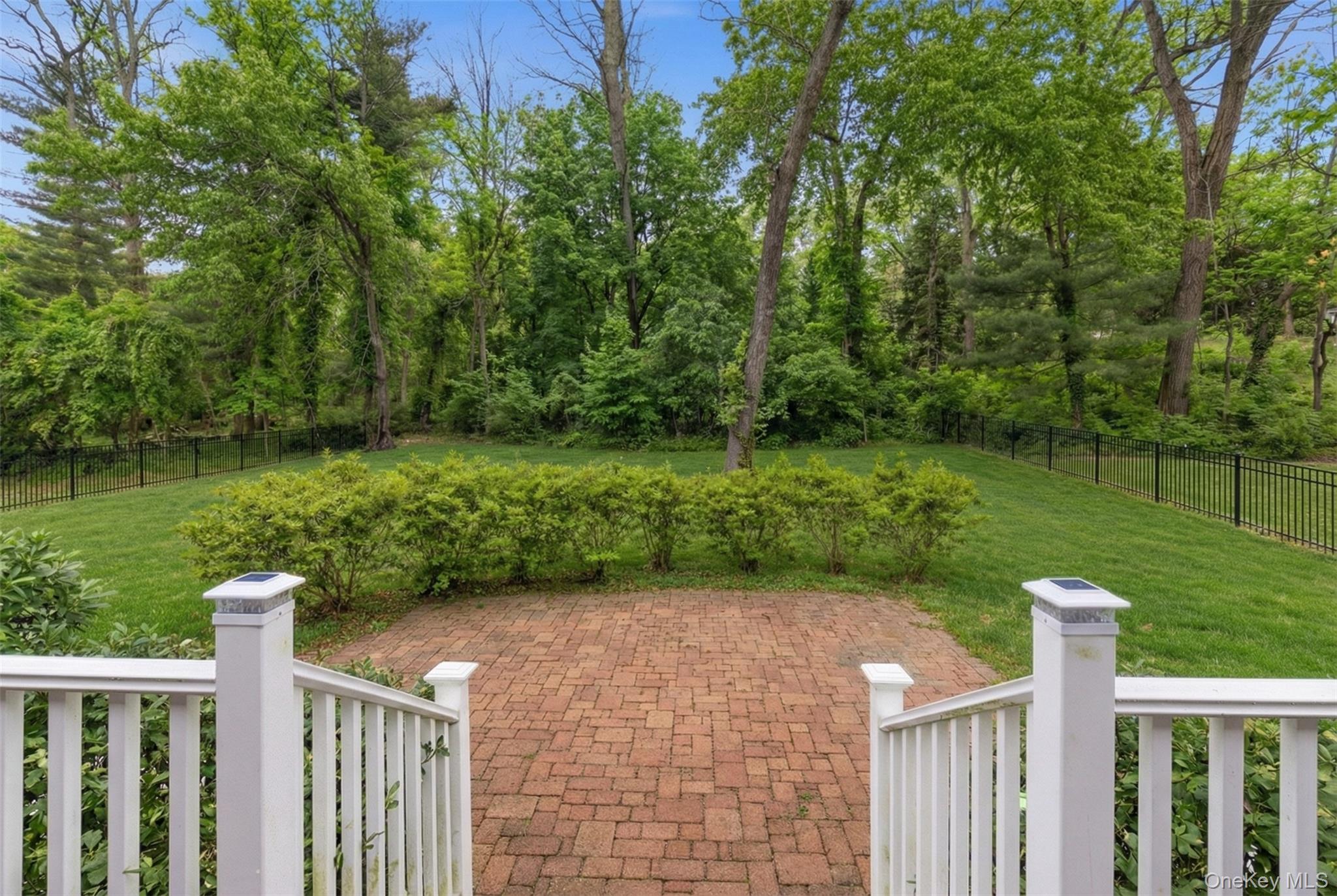 9 Mariners Court Centerport, NY 11721 - Photo 34 of 40 a front view of a house with a yard
