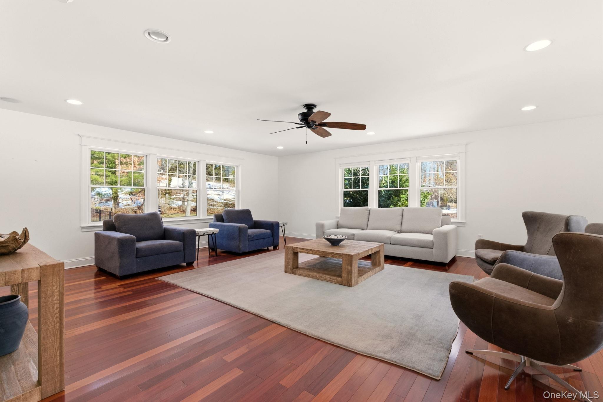 9 Mariners Court Centerport, NY 11721 - Photo 6 of 40 a living room with furniture and a large window
