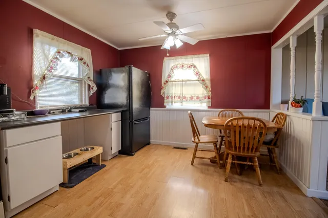 a dining room with furniture and window