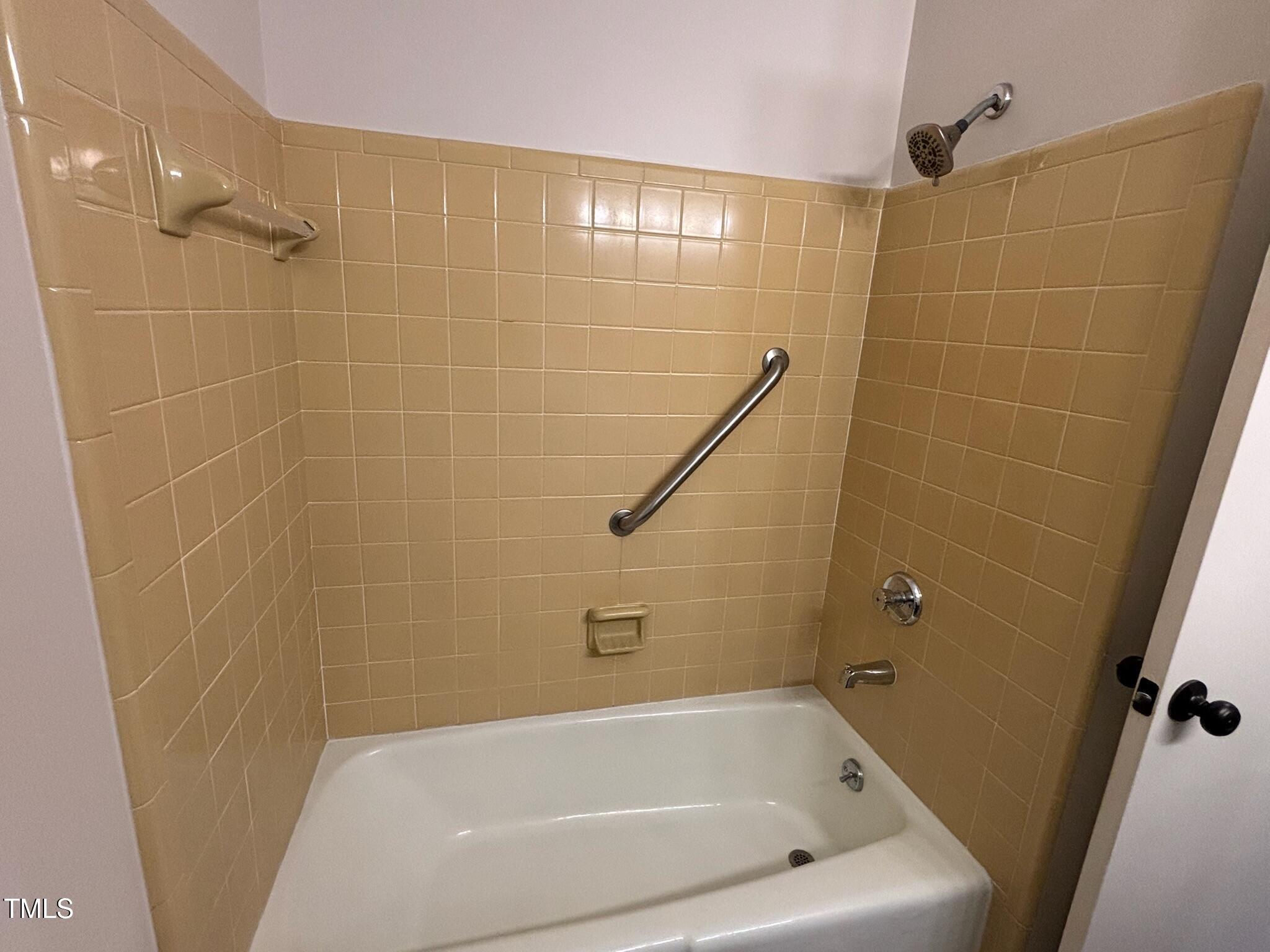 2413 Trawick Road Raleigh, NC 27604 - Photo 18 of 43 a bathroom with a bathtub