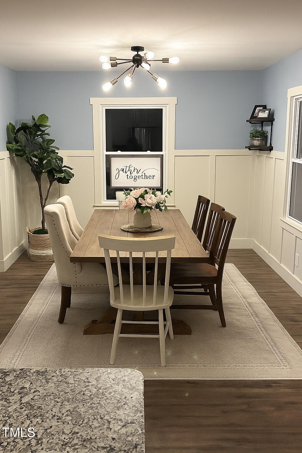 2413 Trawick Road Raleigh, NC 27604 - Photo 3 of 43 a dining room with furniture and wooden floor