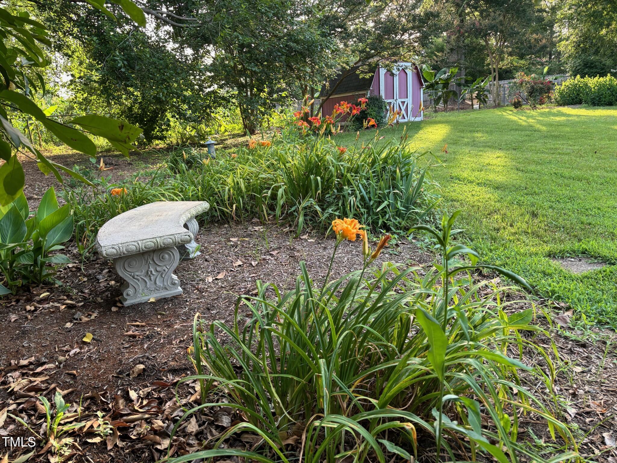 2413 Trawick Road Raleigh, NC 27604 - Photo 35 of 43 a backyard of a house with table and chairs