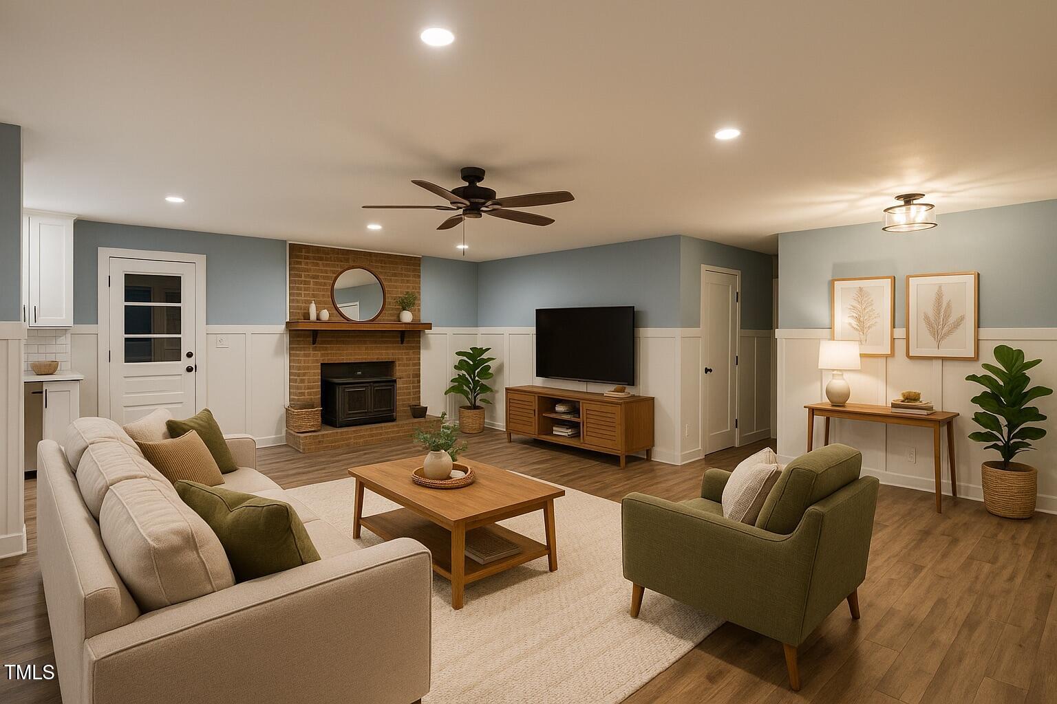 2413 Trawick Road Raleigh, NC 27604 - Photo 4 of 43 a living room with furniture a flat screen tv and a fireplace