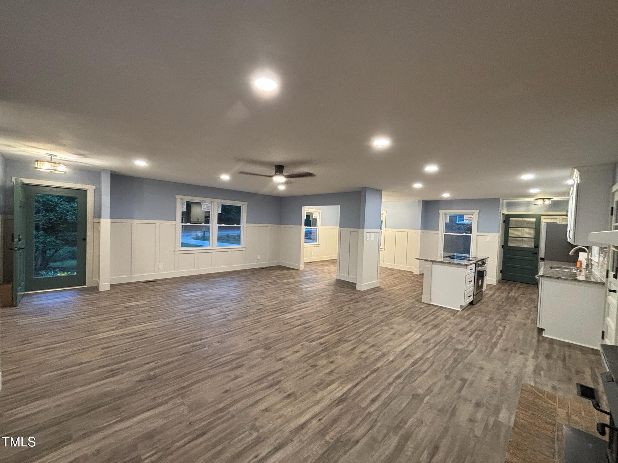 2413 Trawick Road Raleigh, NC 27604 - Photo 5 of 43 a living room with furniture and a wooden floor
