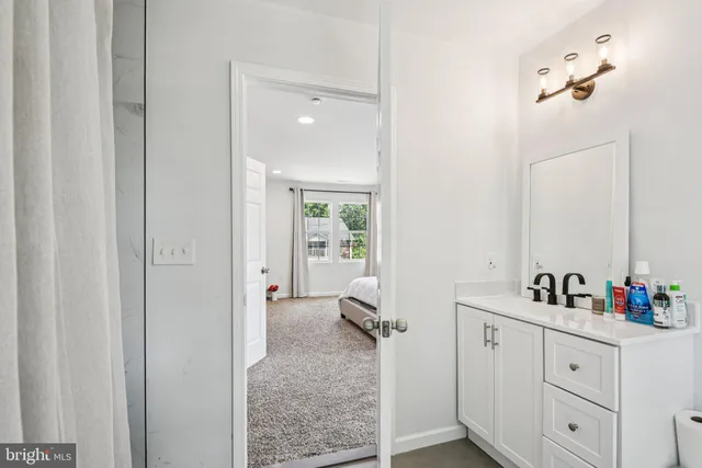 a en suite bathroom with a sink double vanity