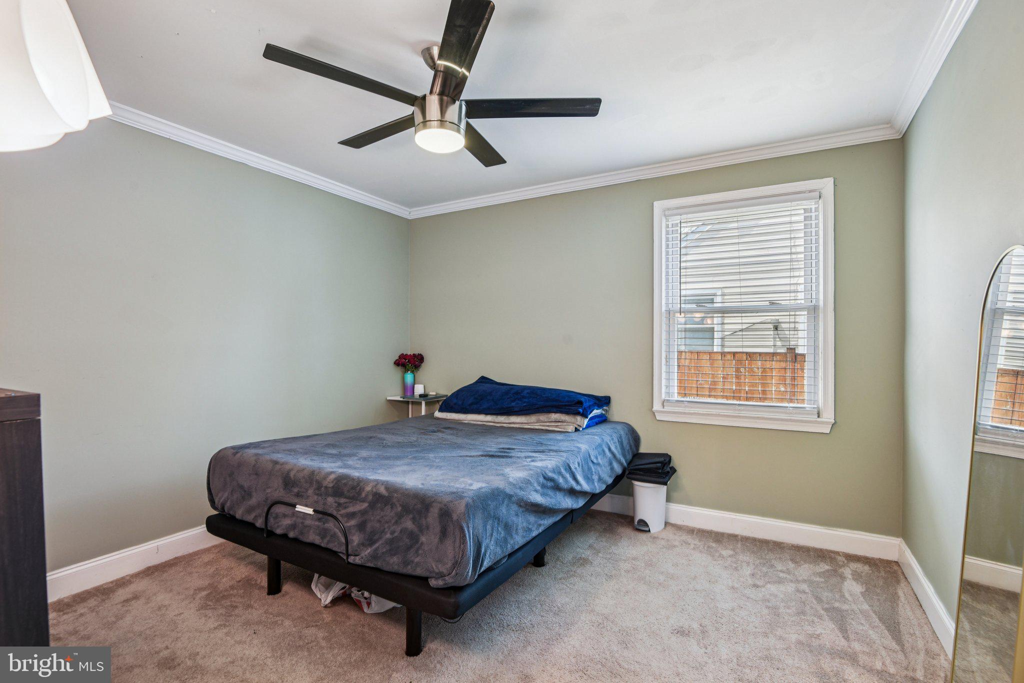 6715 Westcott Road Falls Church, VA 22042 - Photo 13 of 20 a bedroom with a bed and a window