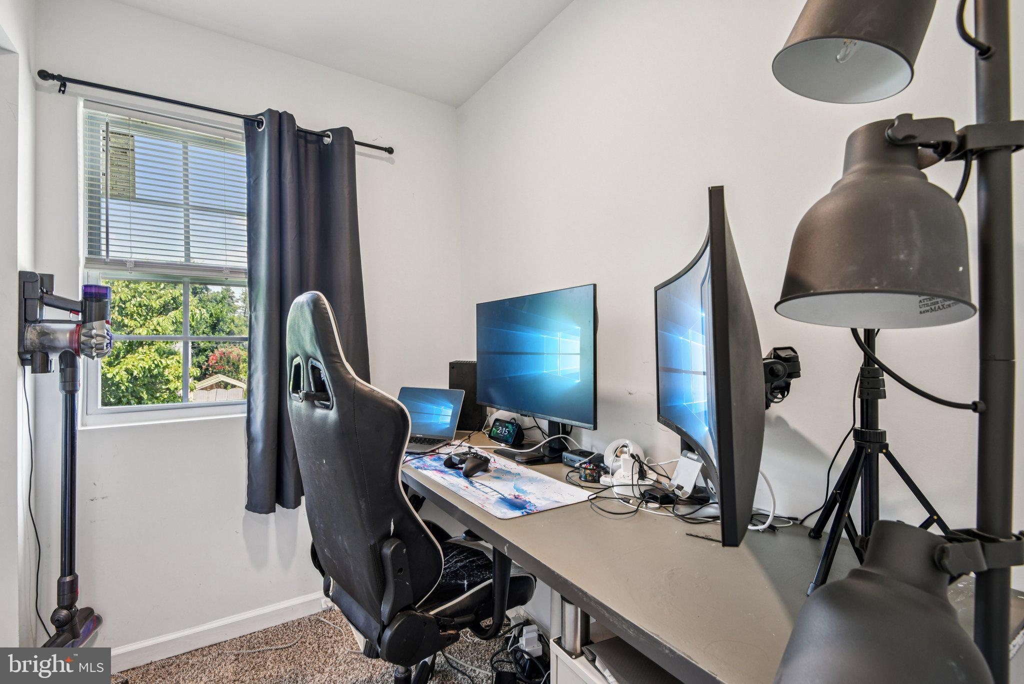 6715 Westcott Road Falls Church, VA 22042 - Photo 15 of 20 a view of a workspace with furniture and a window