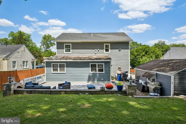 a front view of house with yard and outdoor seating