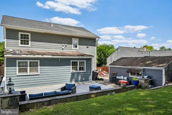 a front view of house with yard and outdoor seating