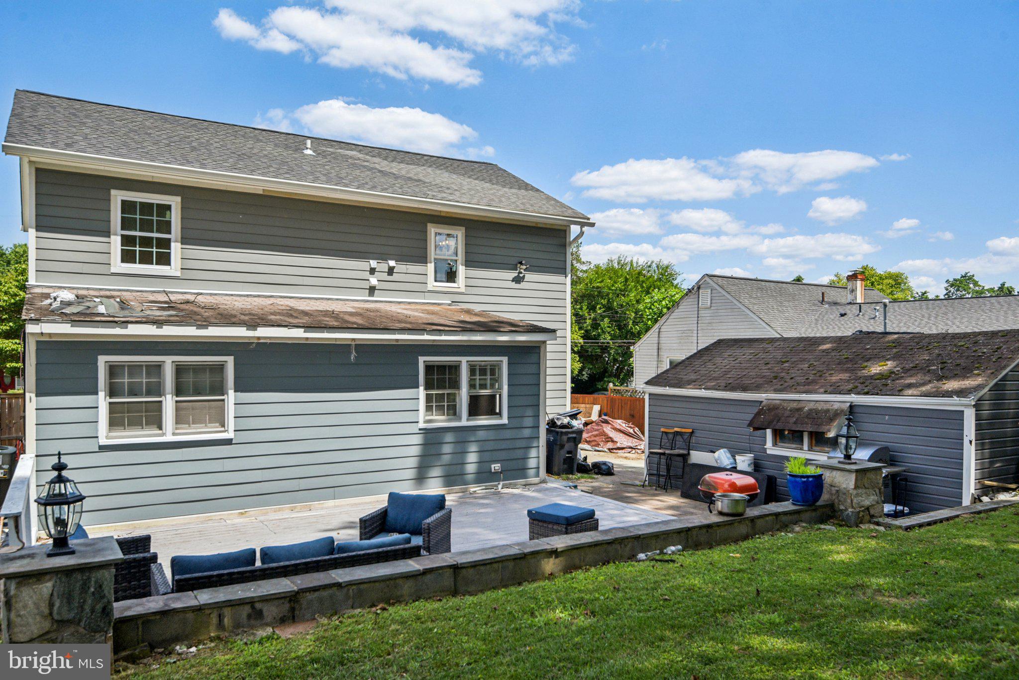 6715 Westcott Road Falls Church, VA 22042 - Photo 20 of 20 a front view of house with yard and outdoor seating