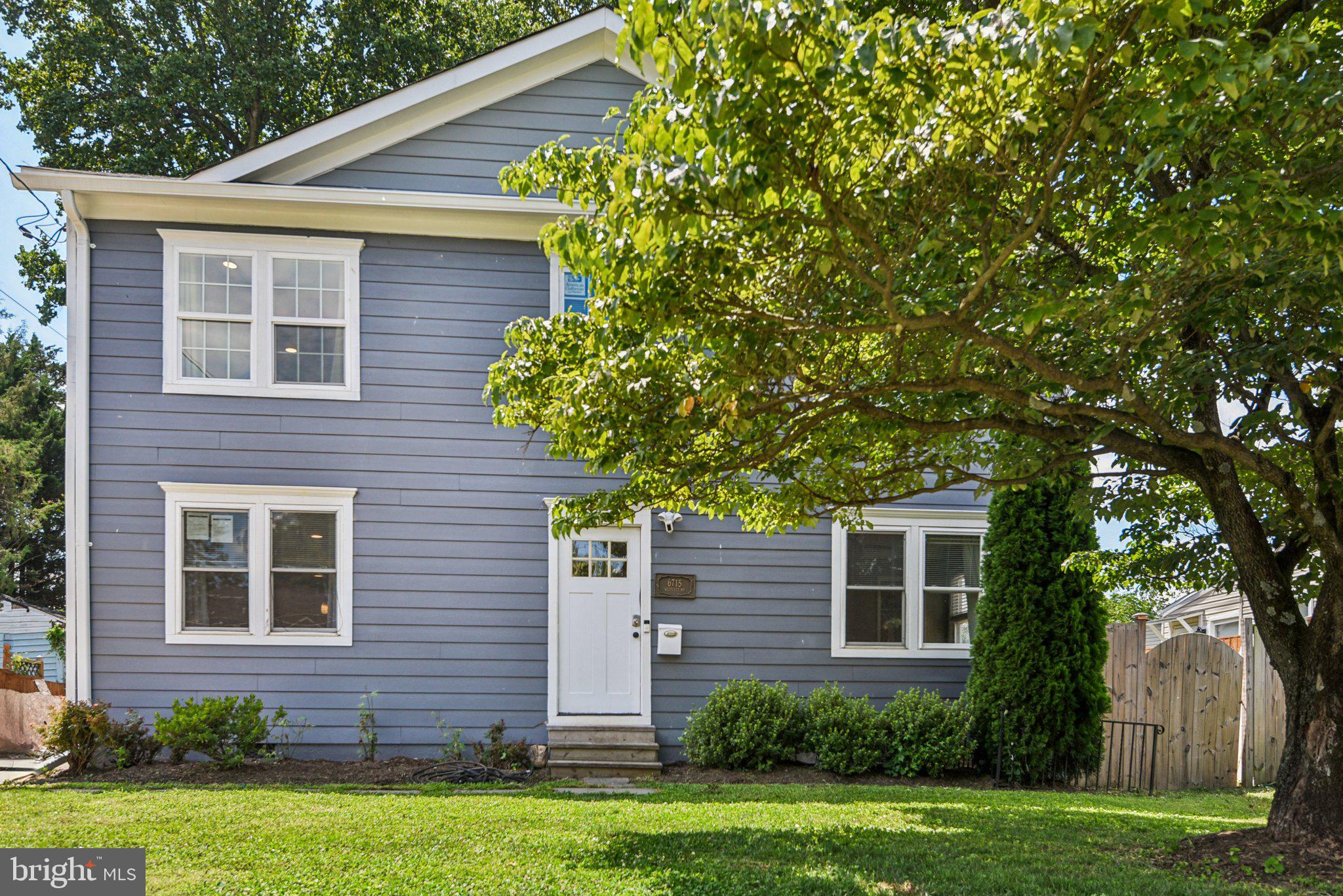 6715 Westcott Road Falls Church, VA 22042 - Photo 2 of 20 a front view of a house with a garden