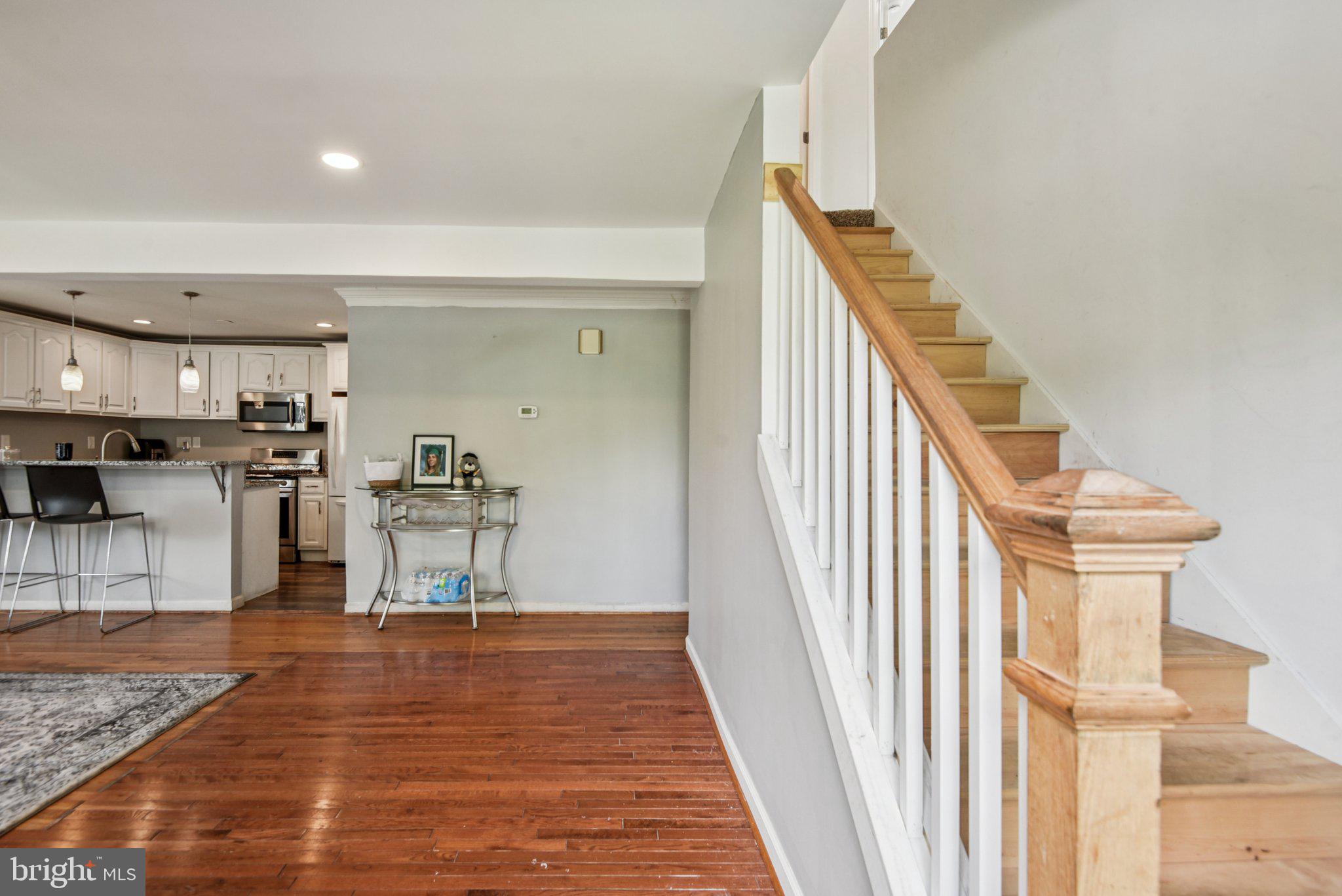 6715 Westcott Road Falls Church, VA 22042 - Photo 5 of 20 a view of kitchen and hall with wooden floor