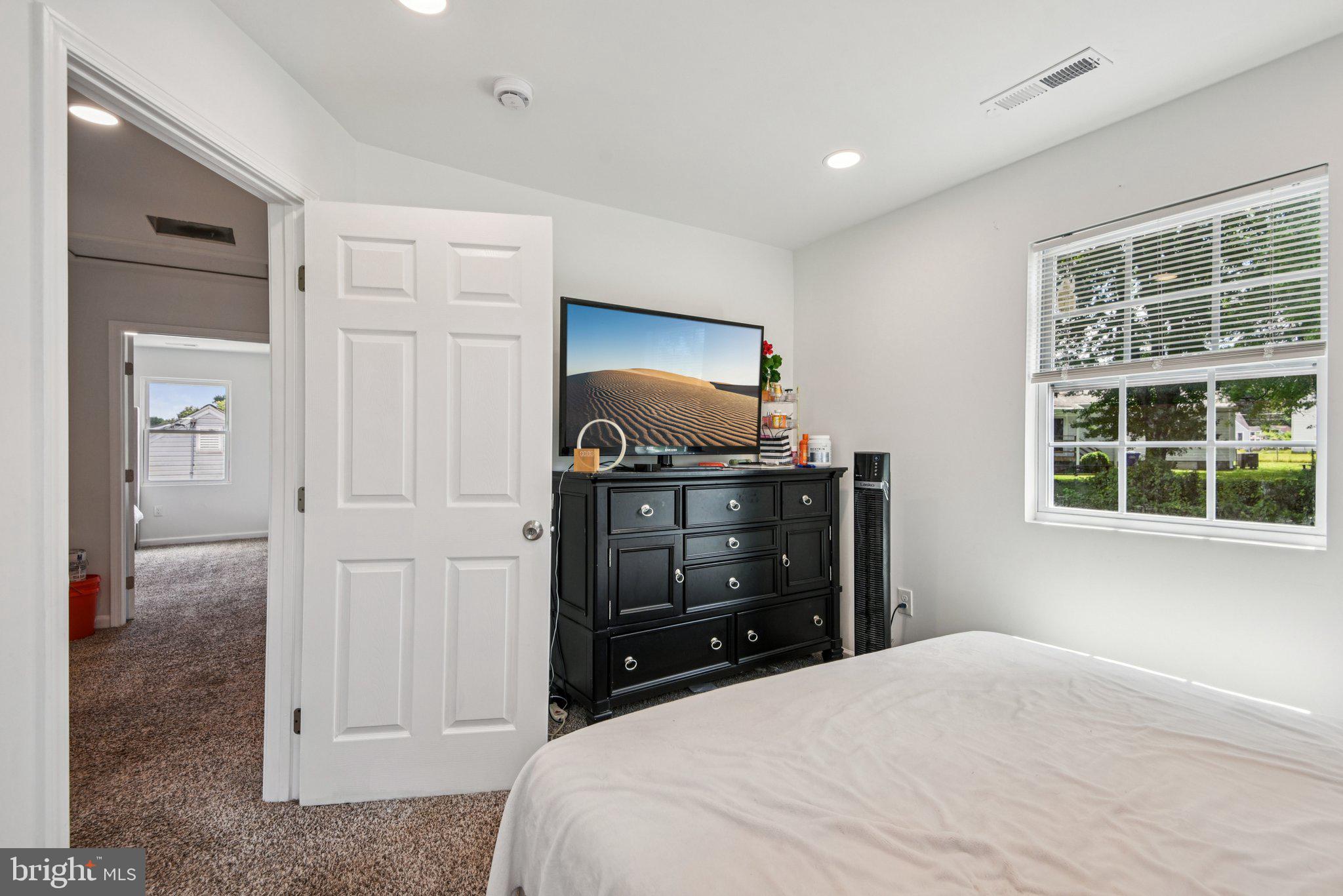 6715 Westcott Road Falls Church, VA 22042 - Photo 9 of 20 a bedroom with a bed and a window